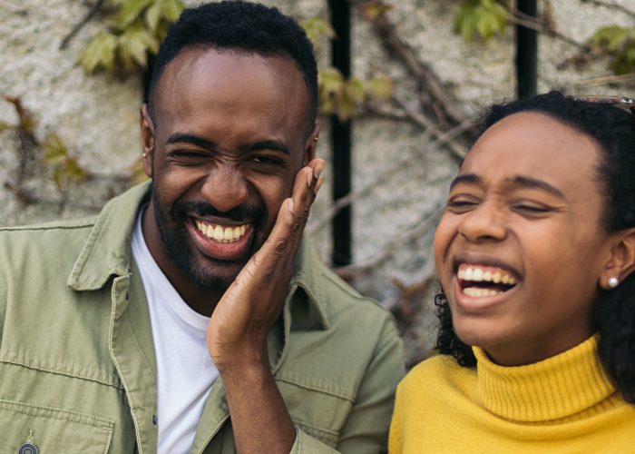 two black people portrait laughing. close-up